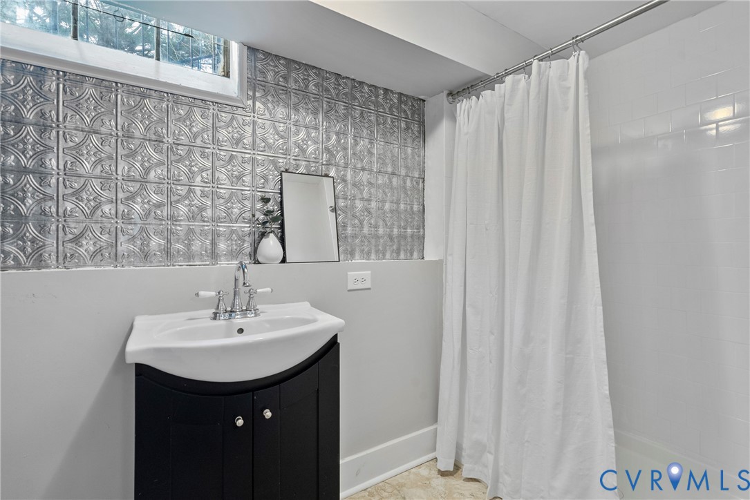 803 Spottswood Road Richmond, VA 23220 - Photo 31 of 50 a bathroom with a sink and a mirror