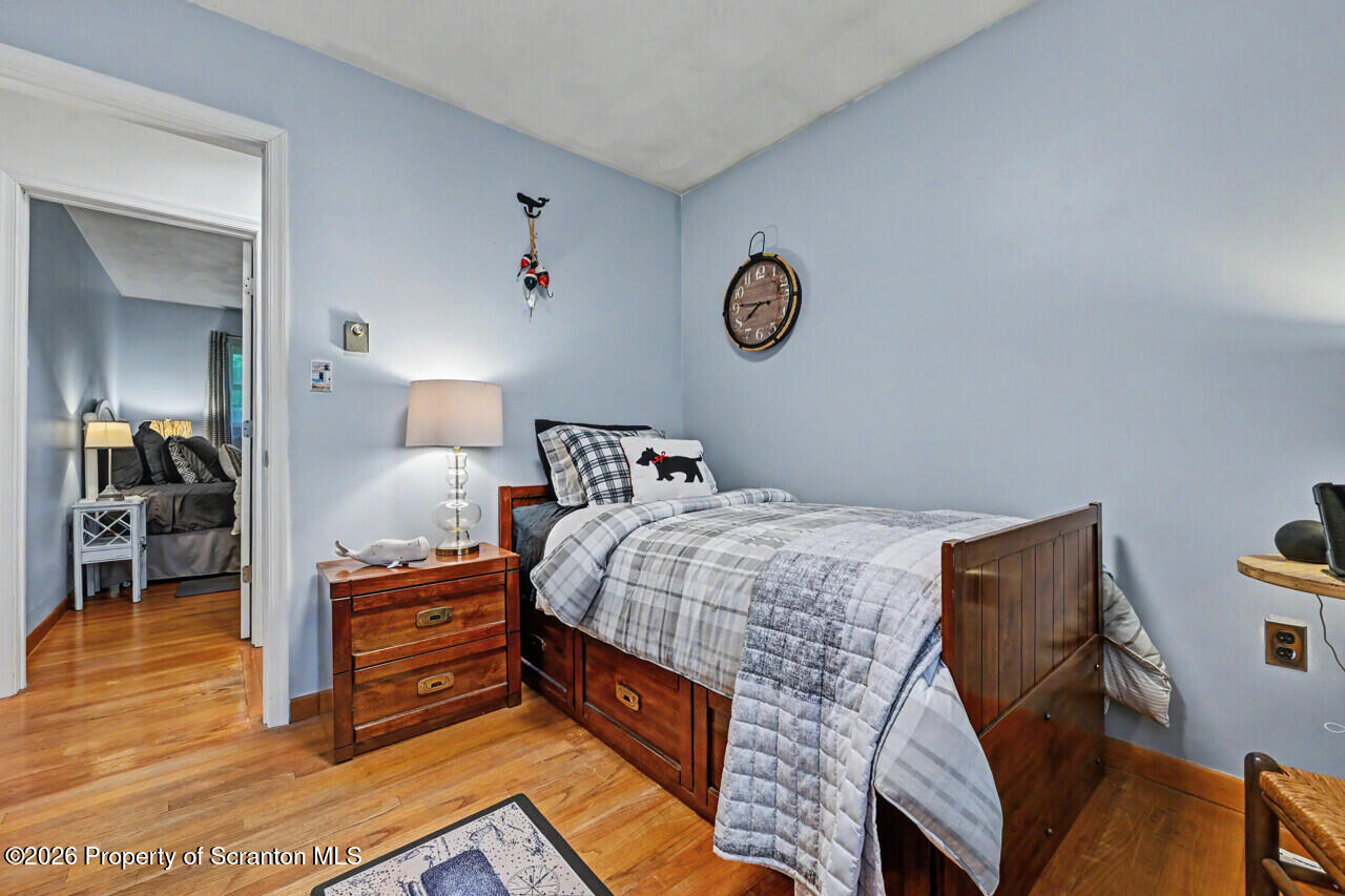 121 T Rt 351 Moscow, PA 18444 - Photo 56 of 79 a bed room with a bed and a chair