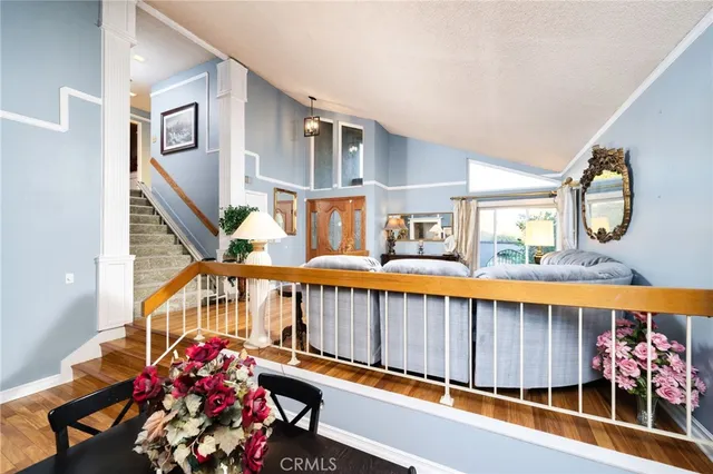 a kitchen with granite countertop a refrigerator and a sink