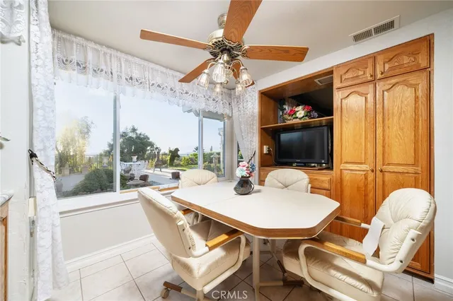 a large white kitchen with a sink and cabinets