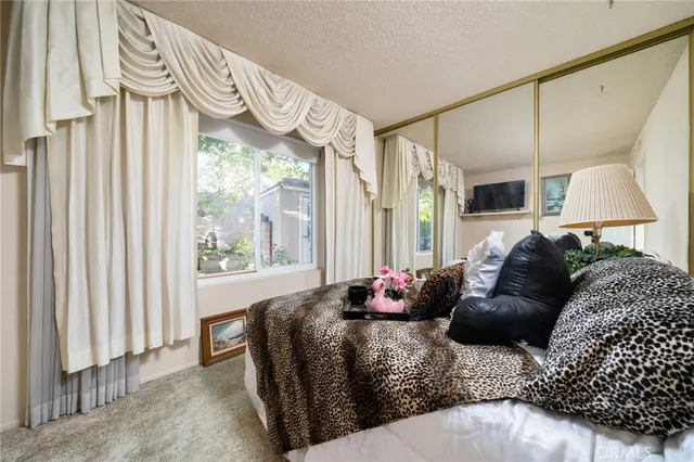 a bathroom with a tub a toilet and a shower