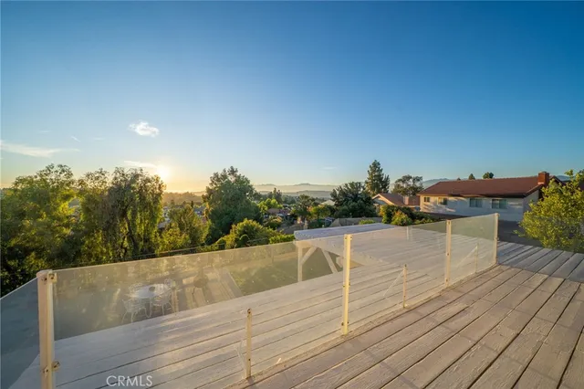 a view of balcony with wooden floor and outdoor space