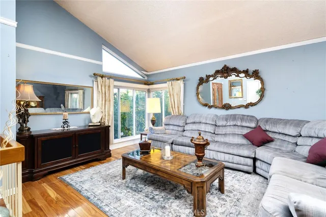 a front view of a house with wooden floor and a stairs