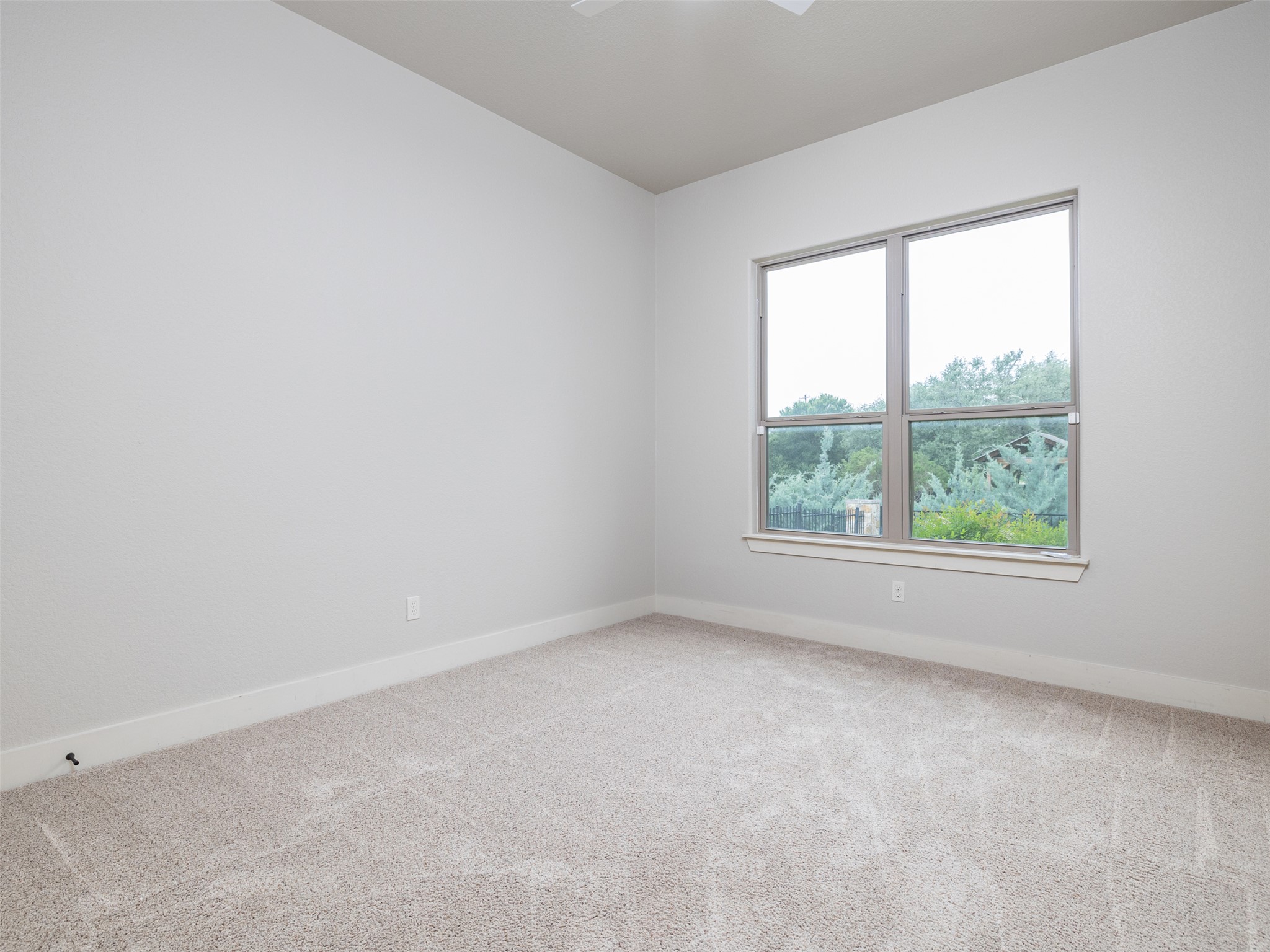 101 Aldea Street Georgetown, TX 78633 - Photo 19 of 40 This is 2 of the 3 secondary bedrooms with updated light fixture.