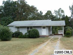 4681 Cureton Ferry Road Catawba, SC 29704 - Photo 1 of 1 a front view of a house with a garden