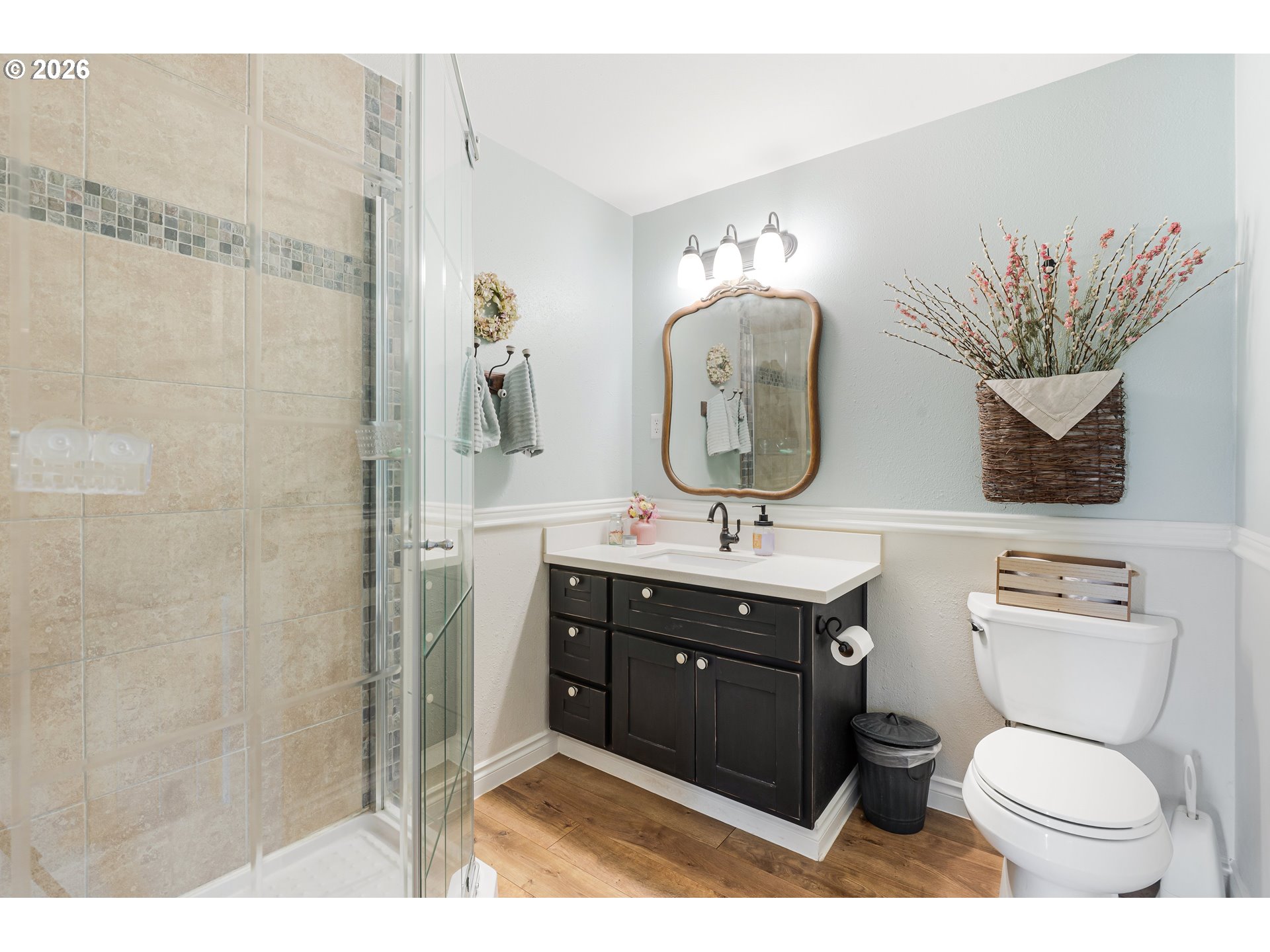7680 Southwest 182nd Place Beaverton, OR 97007 - Photo 12 of 33 a bathroom with a toilet sink vanity granite and a shower