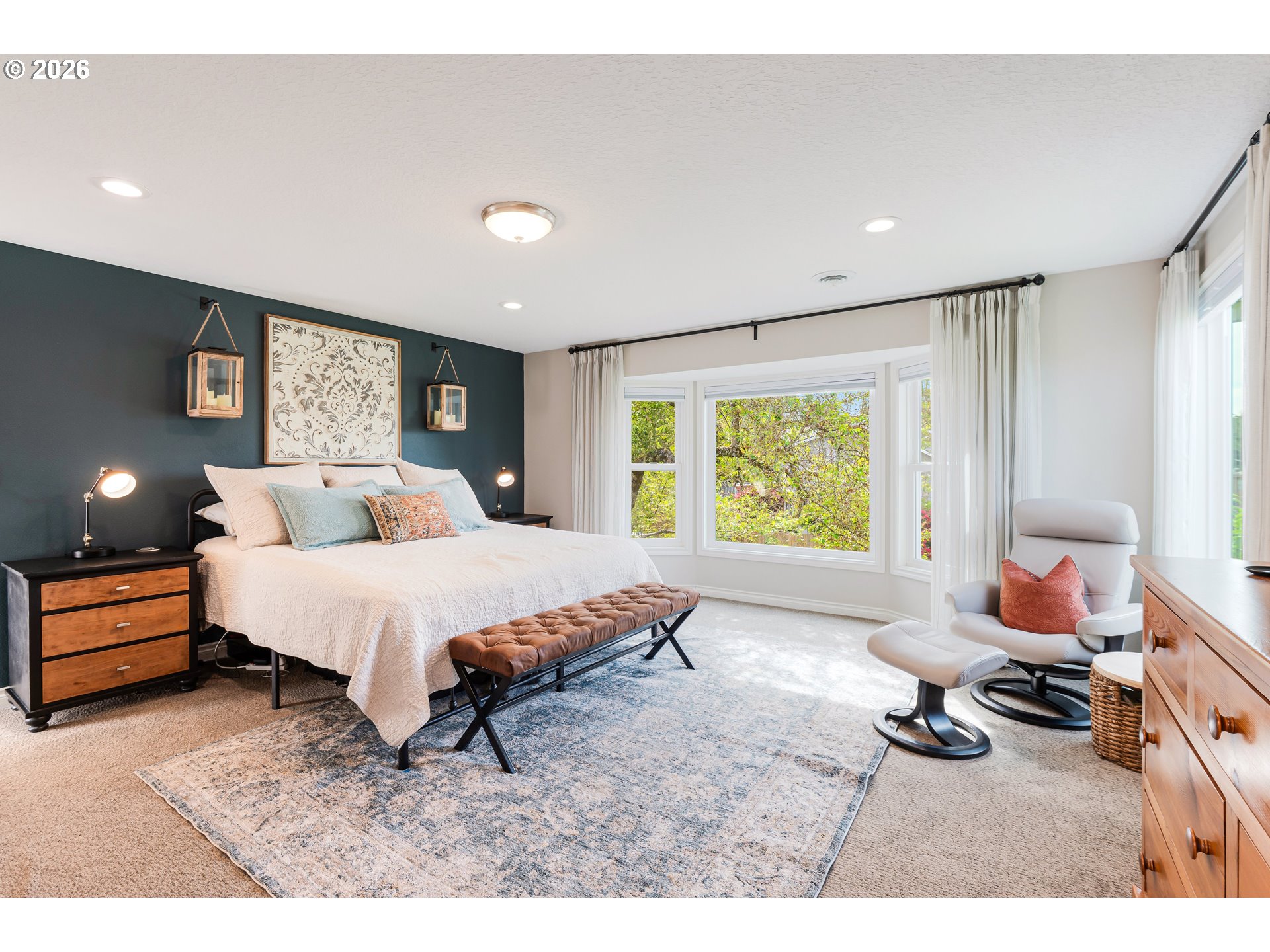 7680 Southwest 182nd Place Beaverton, OR 97007 - Photo 14 of 33 a spacious bedroom with a bed a table and chair