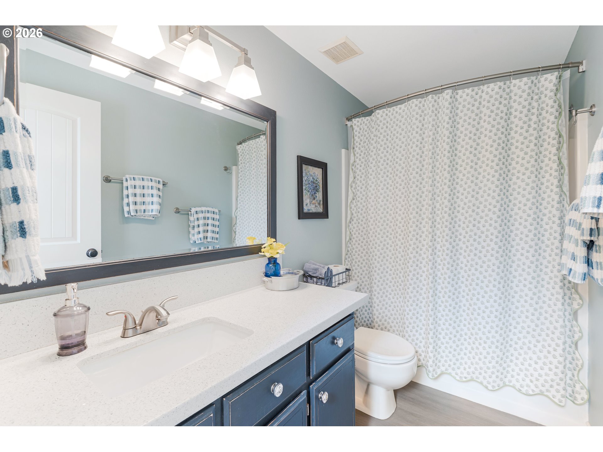 7680 Southwest 182nd Place Beaverton, OR 97007 - Photo 18 of 33 a bathroom with a sink a toilet and mirror