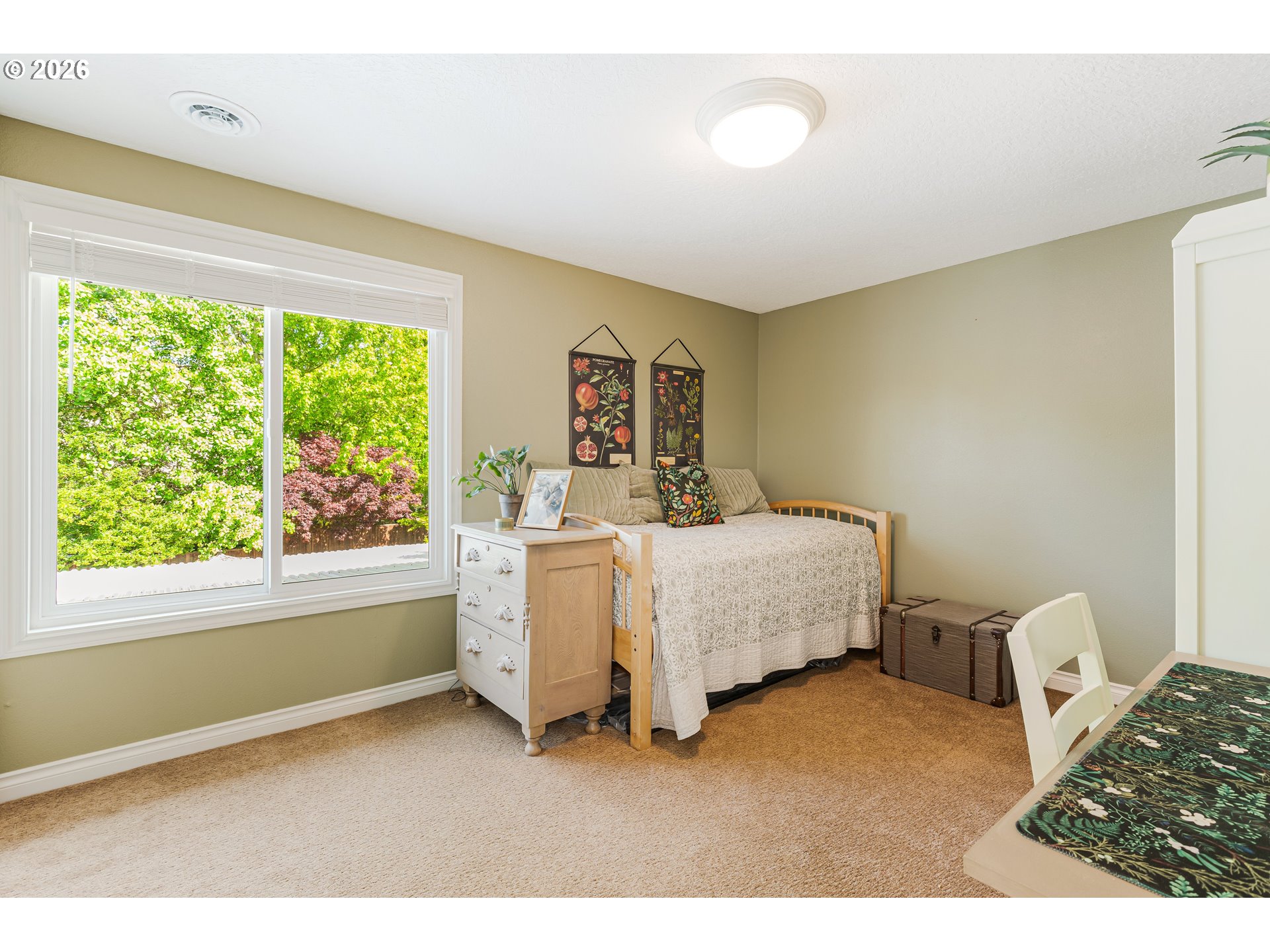 7680 Southwest 182nd Place Beaverton, OR 97007 - Photo 19 of 33 a spacious bedroom with a bed and a large window
