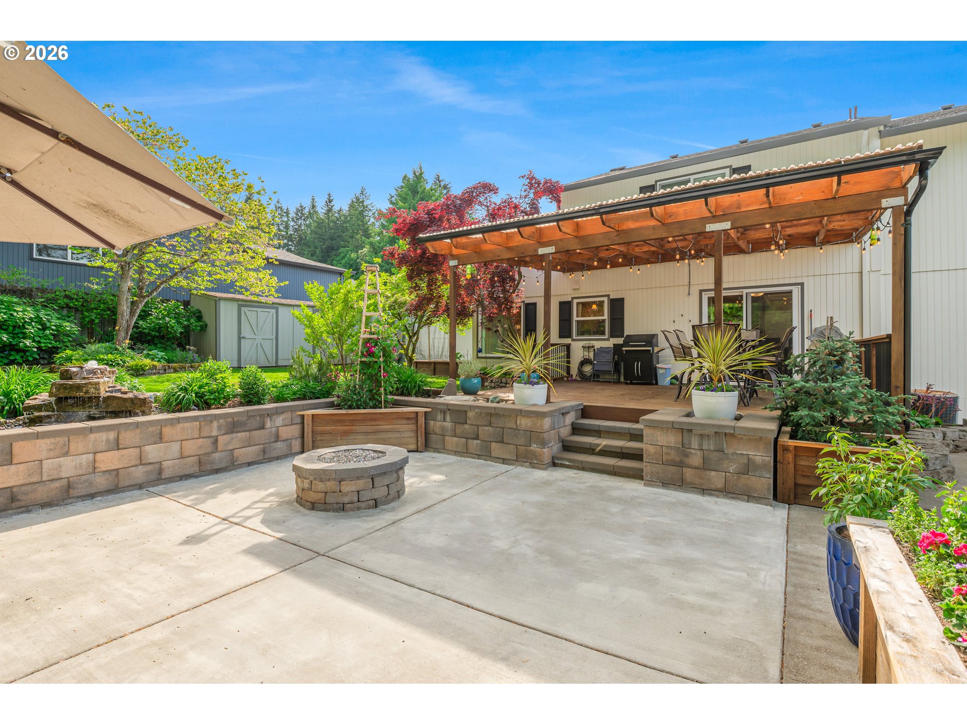 7680 Southwest 182nd Place Beaverton, OR 97007 - Photo 21 of 33 a view of a patio with couches table and chairs potted plants