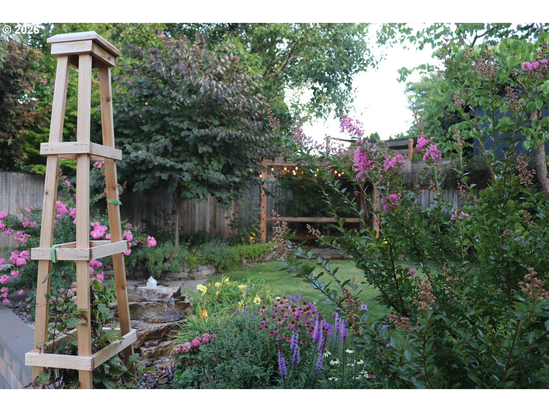 7680 Southwest 182nd Place Beaverton, OR 97007 - Photo 29 of 33 a view of flower garden with wooden bridge