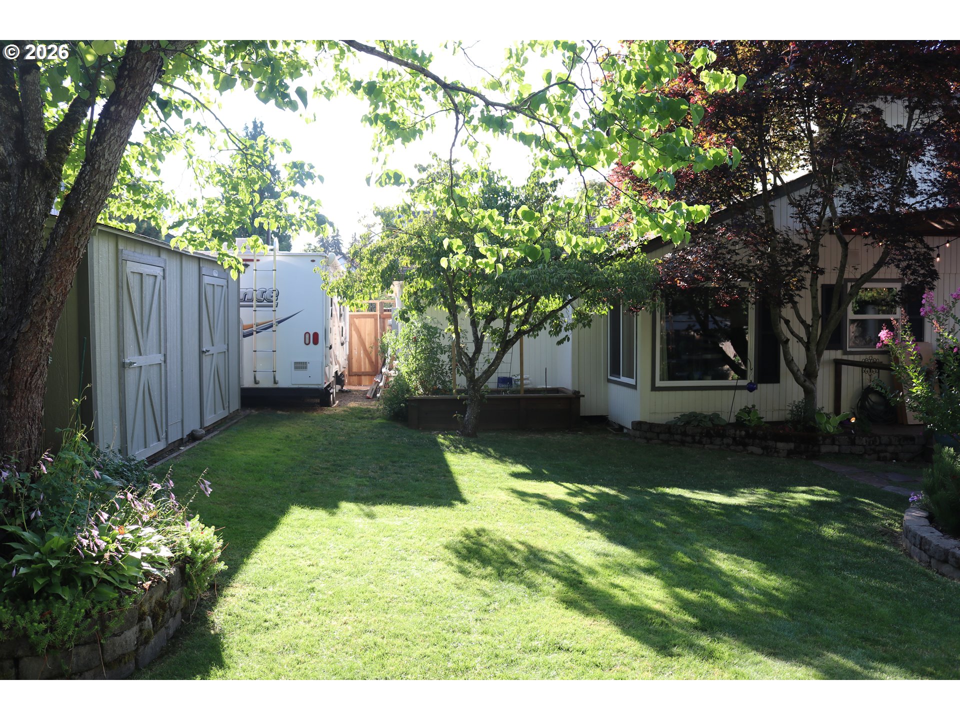 7680 Southwest 182nd Place Beaverton, OR 97007 - Photo 30 of 33 a view of a backyard with large trees