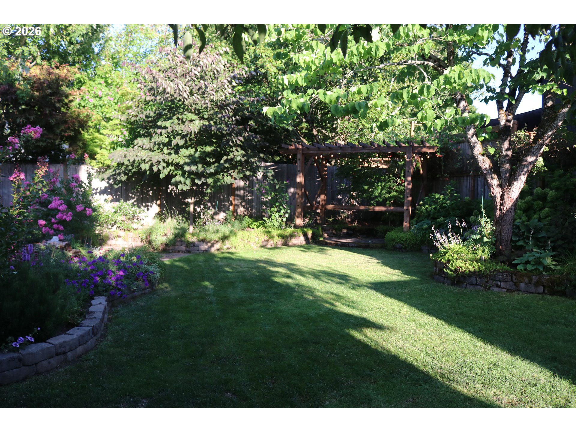 7680 Southwest 182nd Place Beaverton, OR 97007 - Photo 31 of 33 a view of a flower garden in a backyard