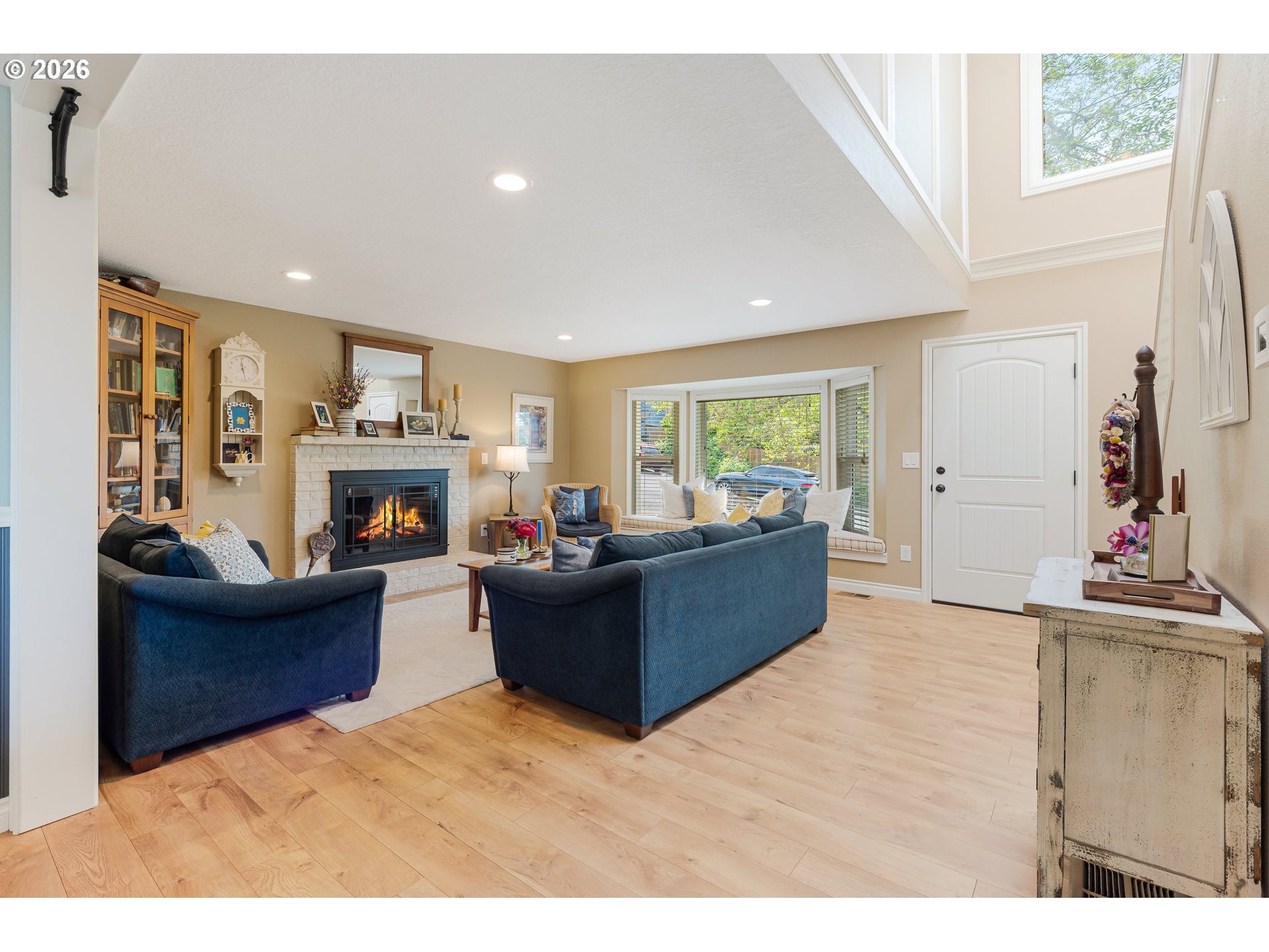 7680 Southwest 182nd Place Beaverton, OR 97007 - Photo 6 of 33 a living room with furniture and a fireplace
