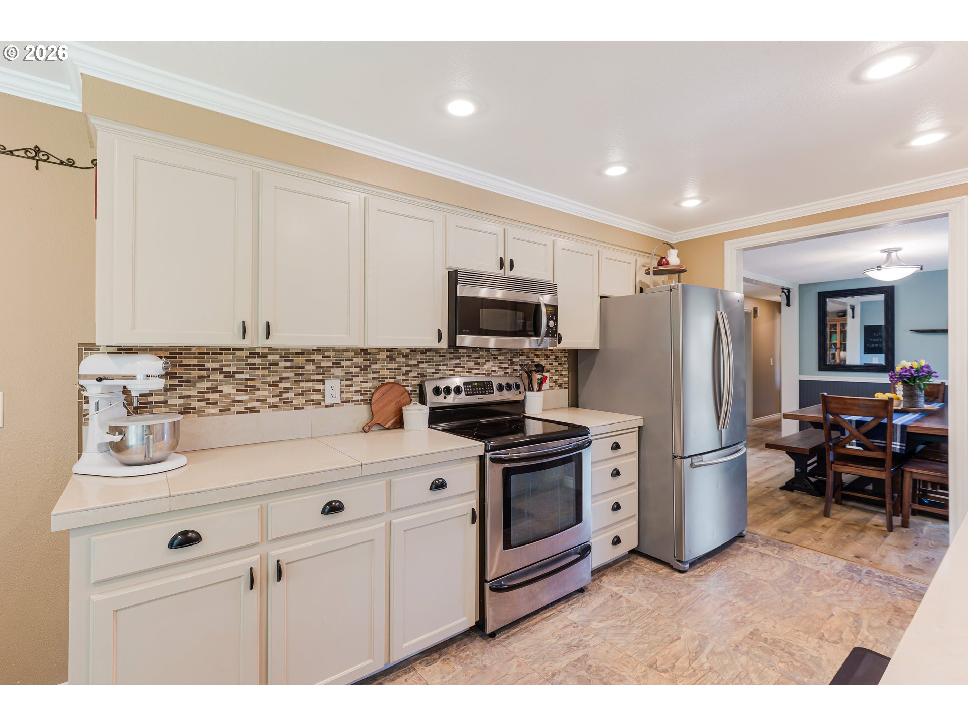 7680 Southwest 182nd Place Beaverton, OR 97007 - Photo 10 of 33 a kitchen with a sink stainless steel appliances and cabinets