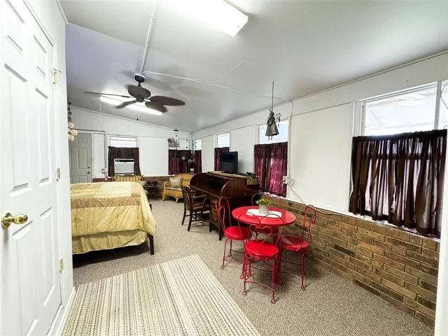 a bed room with furniture and a chandelier