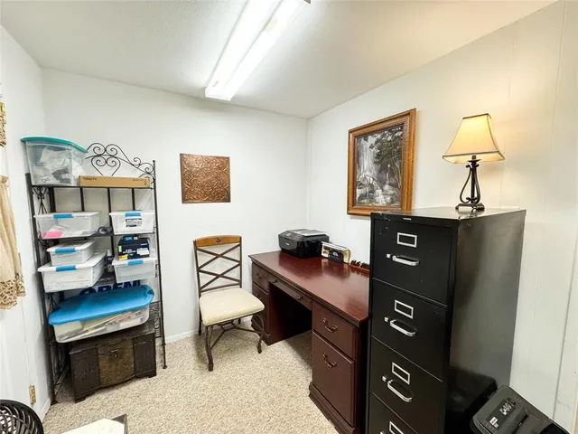 a view of a workspace with furniture