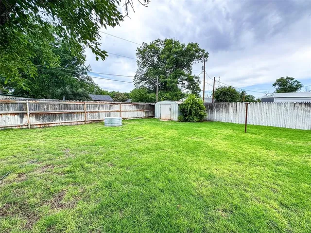 a view of a house with a big yard