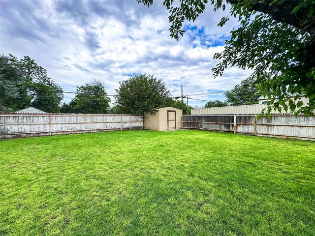 a view of a house with a yard and sitting area