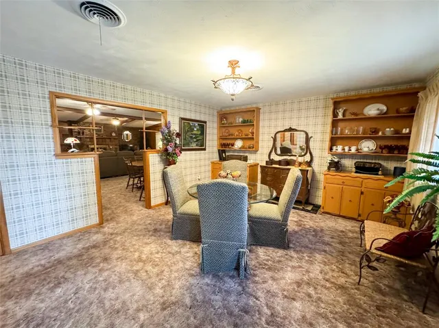 a view of a livingroom with furniture