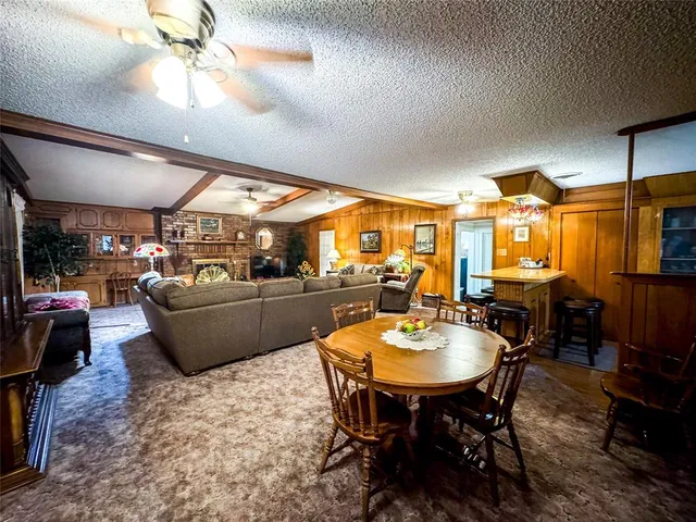 a living room with lots of furniture and a chandelier