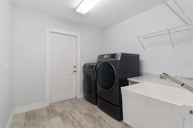 a utility room with dryer and washer