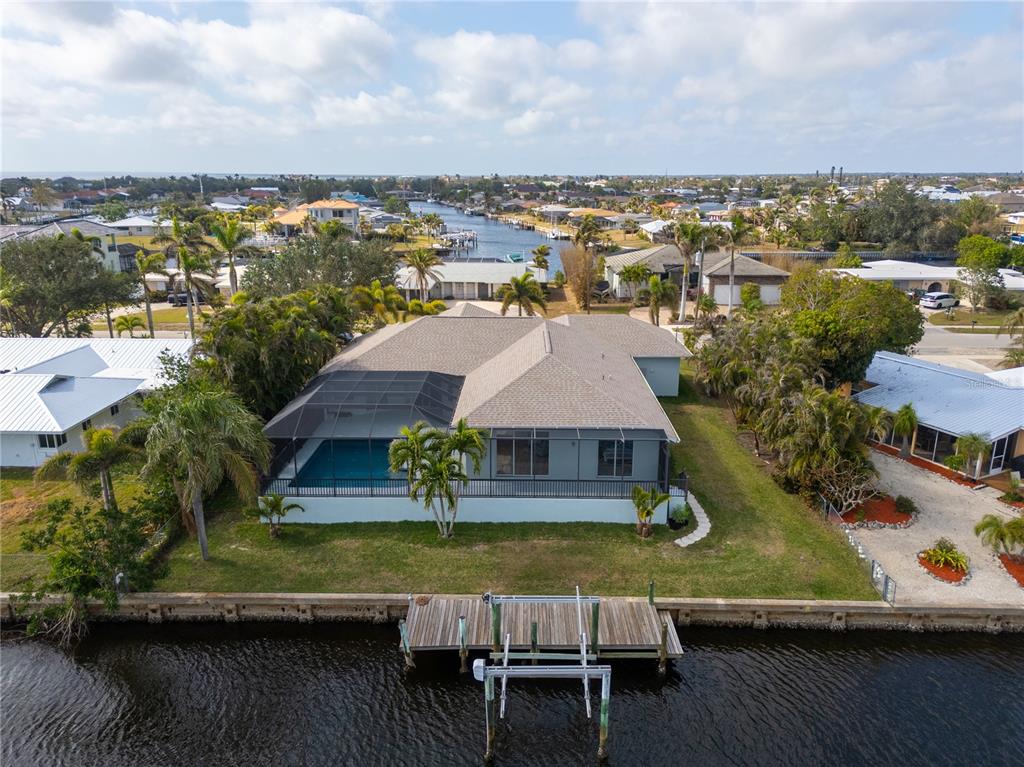 193 Beeney Road Southeast Port Charlotte, FL 33952 - Photo 4 of 45 an aerial view of residential houses with outdoor space