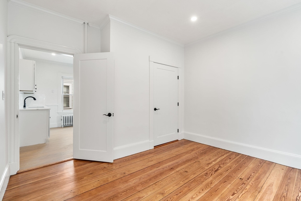 93 Sydney Street, Unit 3 Boston, MA 02125 - Photo 12 of 28 wooden floor in an empty room