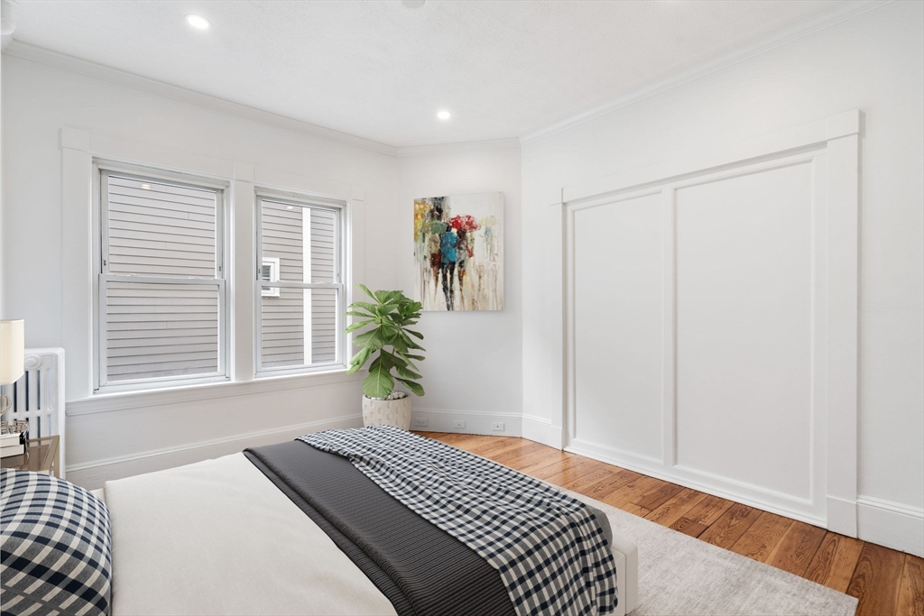 93 Sydney Street, Unit 3 Boston, MA 02125 - Photo 2 of 28 a bedroom with a bed and a window