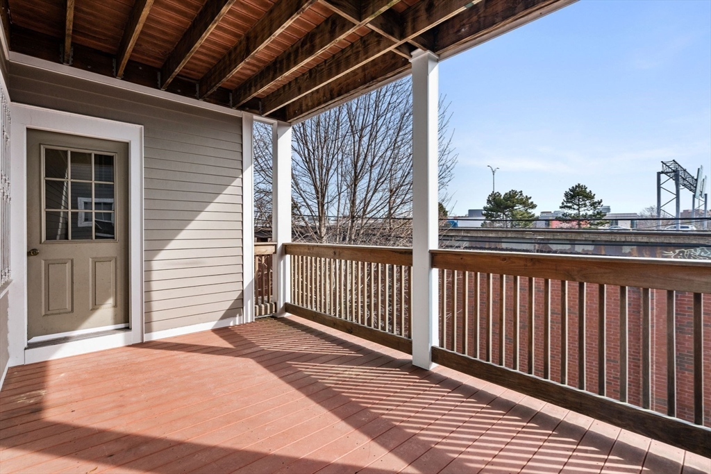 93 Sydney Street, Unit 3 Boston, MA 02125 - Photo 24 of 28 a view of a balcony with wooden floor