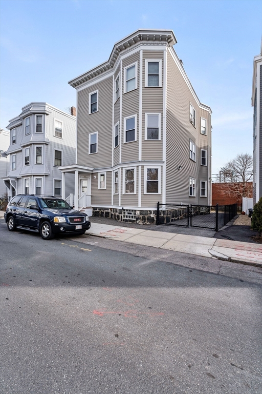 93 Sydney Street, Unit 3 Boston, MA 02125 - Photo 26 of 28 a front view of a building with street
