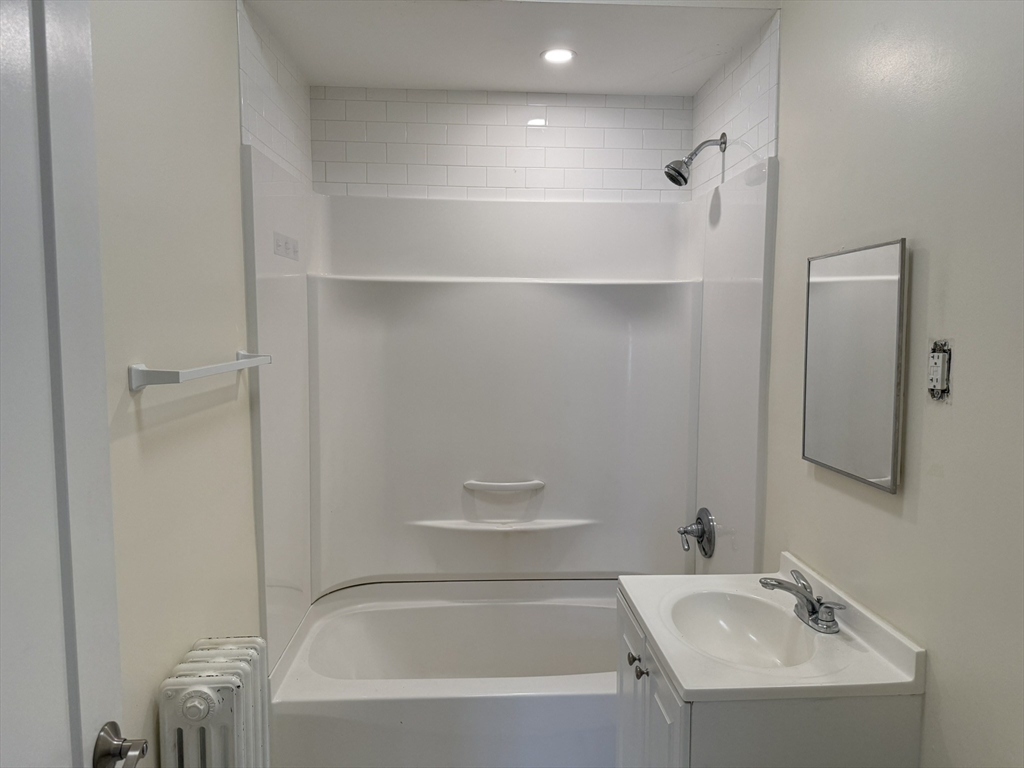 93 Sydney Street, Unit 3 Boston, MA 02125 - Photo 6 of 28 a bathroom with a bathtub and shower