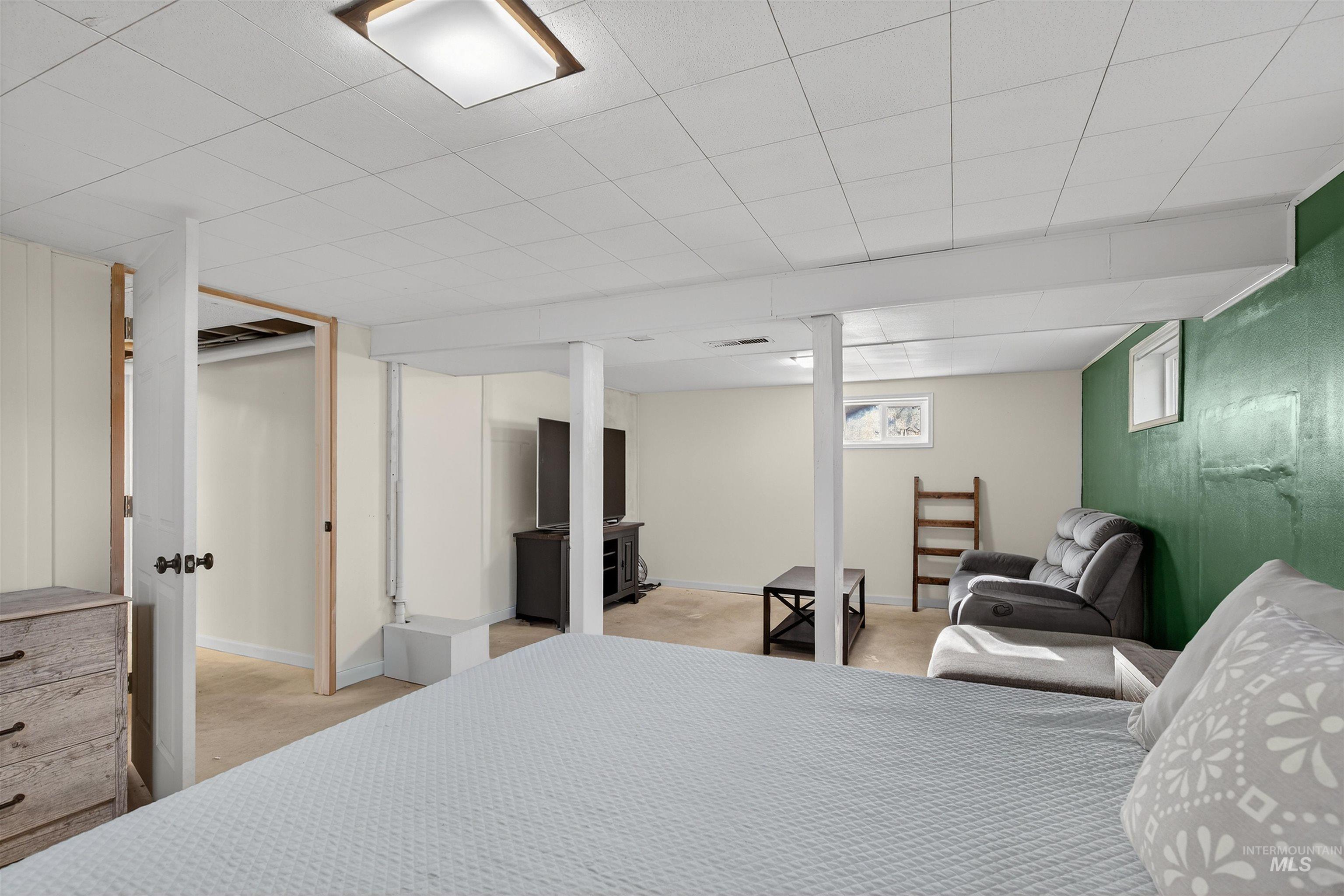 209 Walnut Drive Potlatch, ID 83855 - Photo 17 of 27 Bedroom with light carpet and baseboards