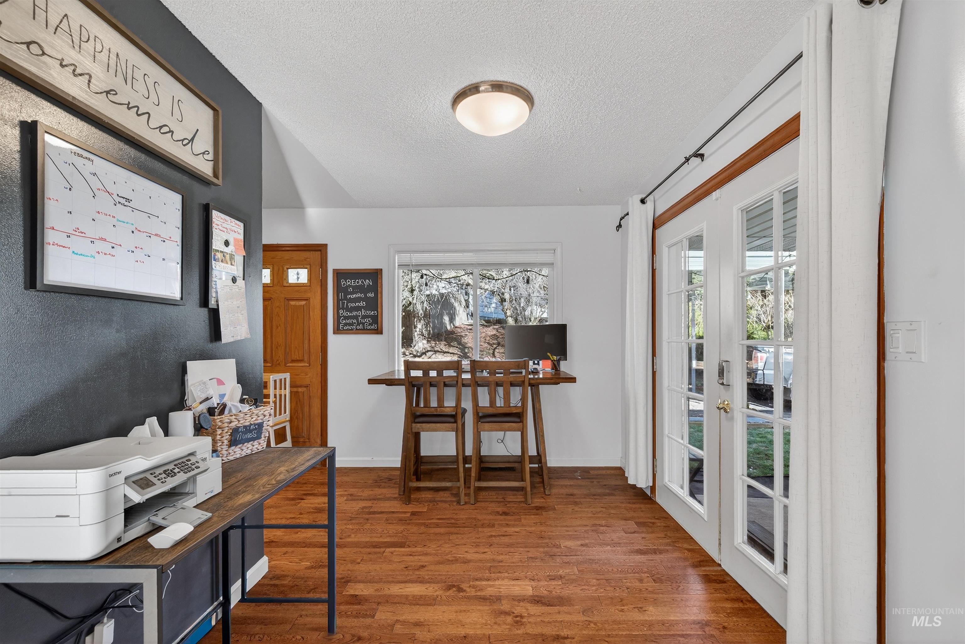 209 Walnut Drive Potlatch, ID 83855 - Photo 7 of 27 Office featuring wood finished floors and a textured ceiling