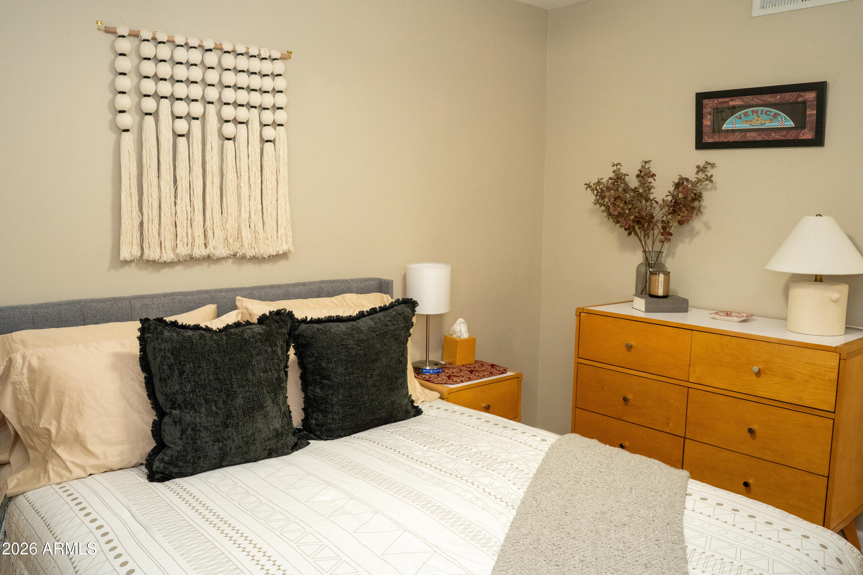 4313 North 28th Street Phoenix, AZ 85016 - Photo 15 of 26 a bedroom with a bed and a chandelier