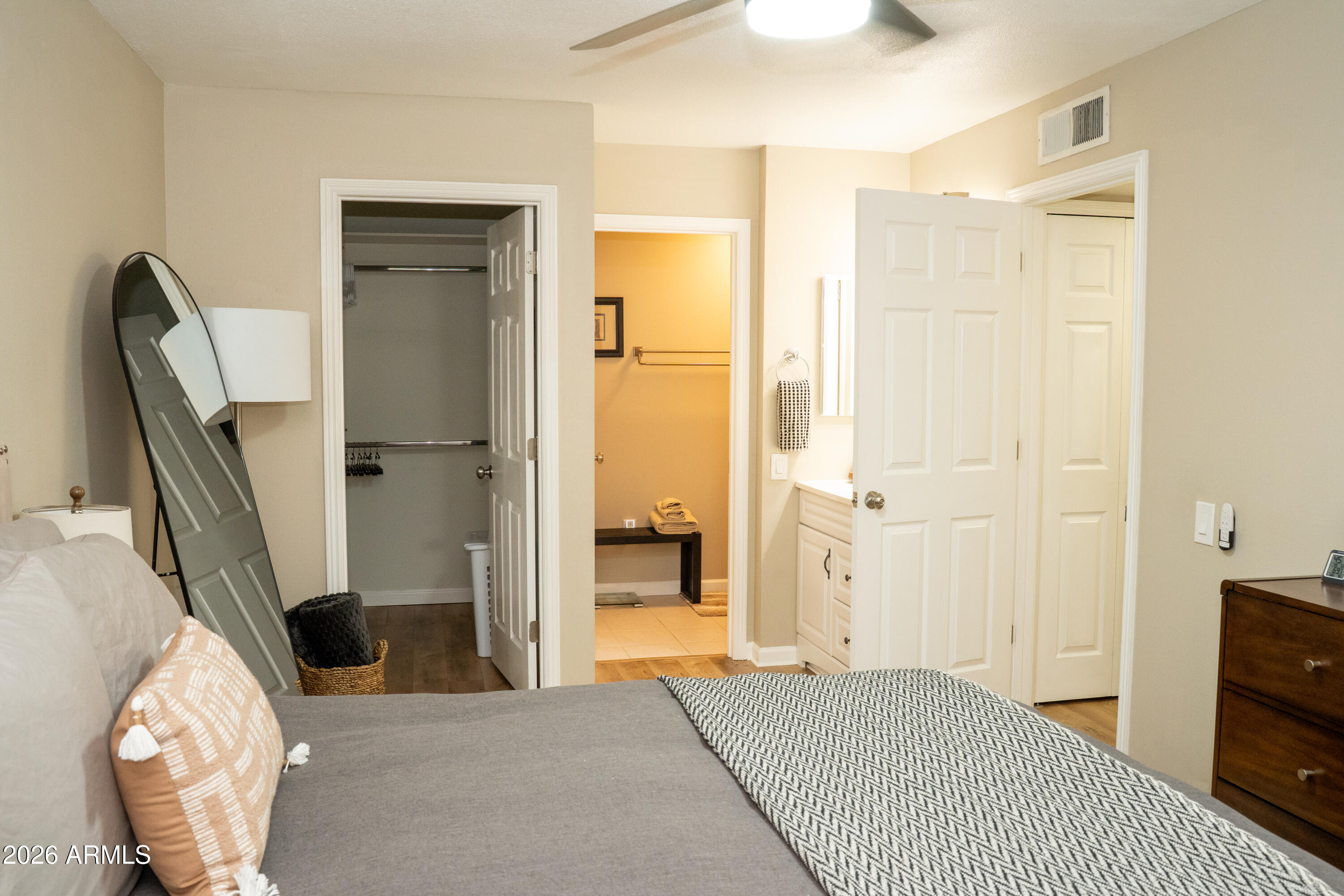 4313 North 28th Street Phoenix, AZ 85016 - Photo 16 of 26 a bedroom with a bed and a large mirror