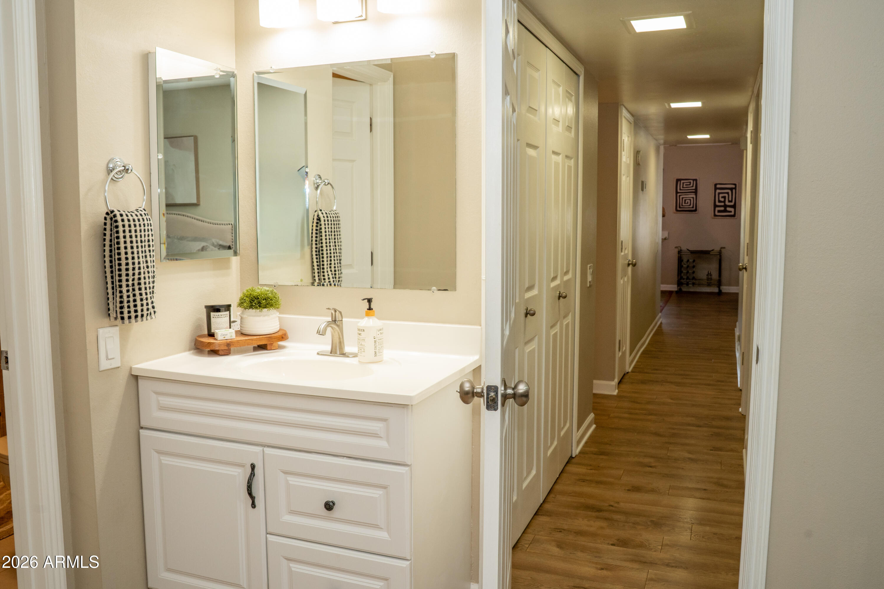 4313 North 28th Street Phoenix, AZ 85016 - Photo 17 of 26 a bathroom with a sink a mirror a vanity and shower
