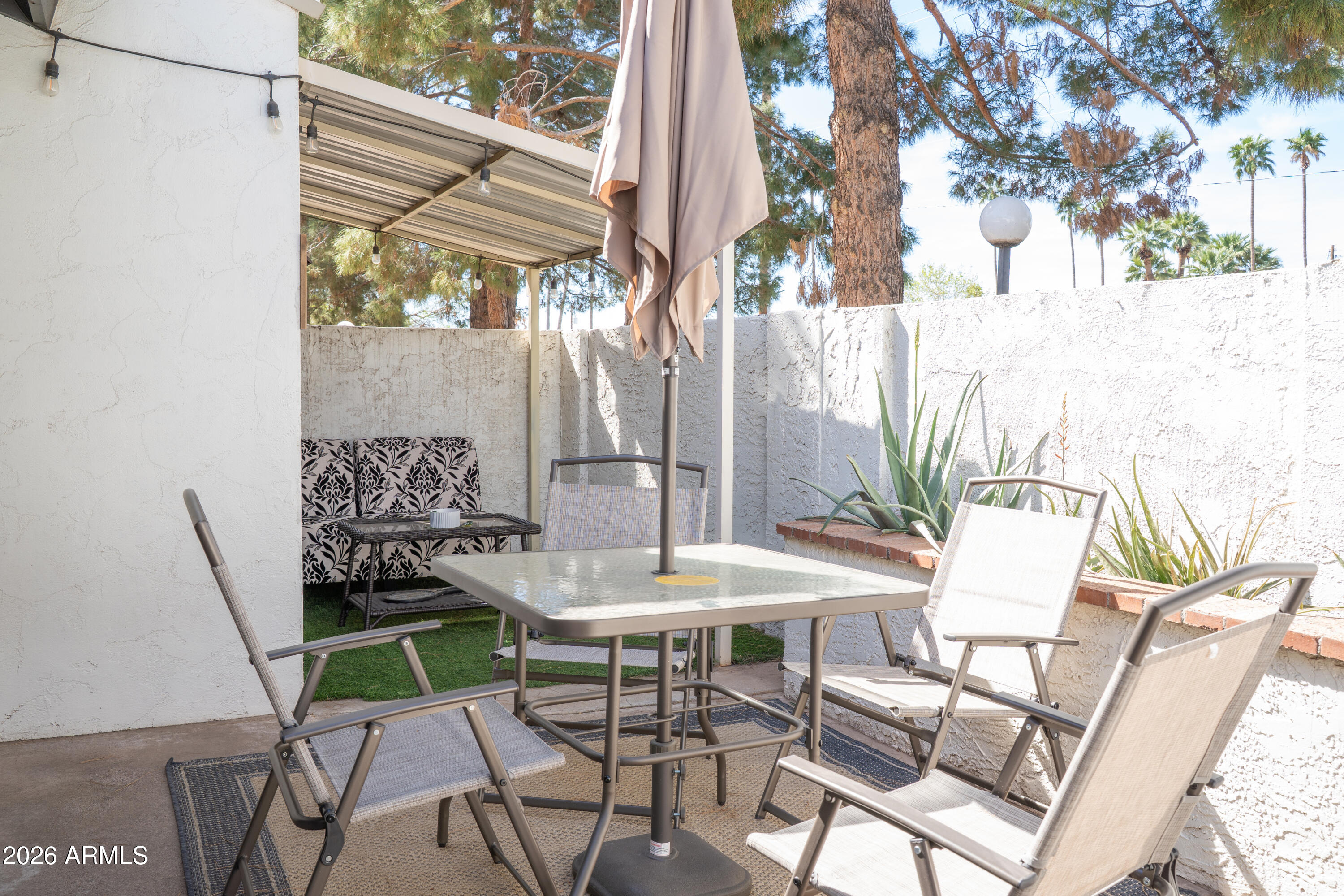 4313 North 28th Street Phoenix, AZ 85016 - Photo 20 of 26 a view of a patio with a table and chairs