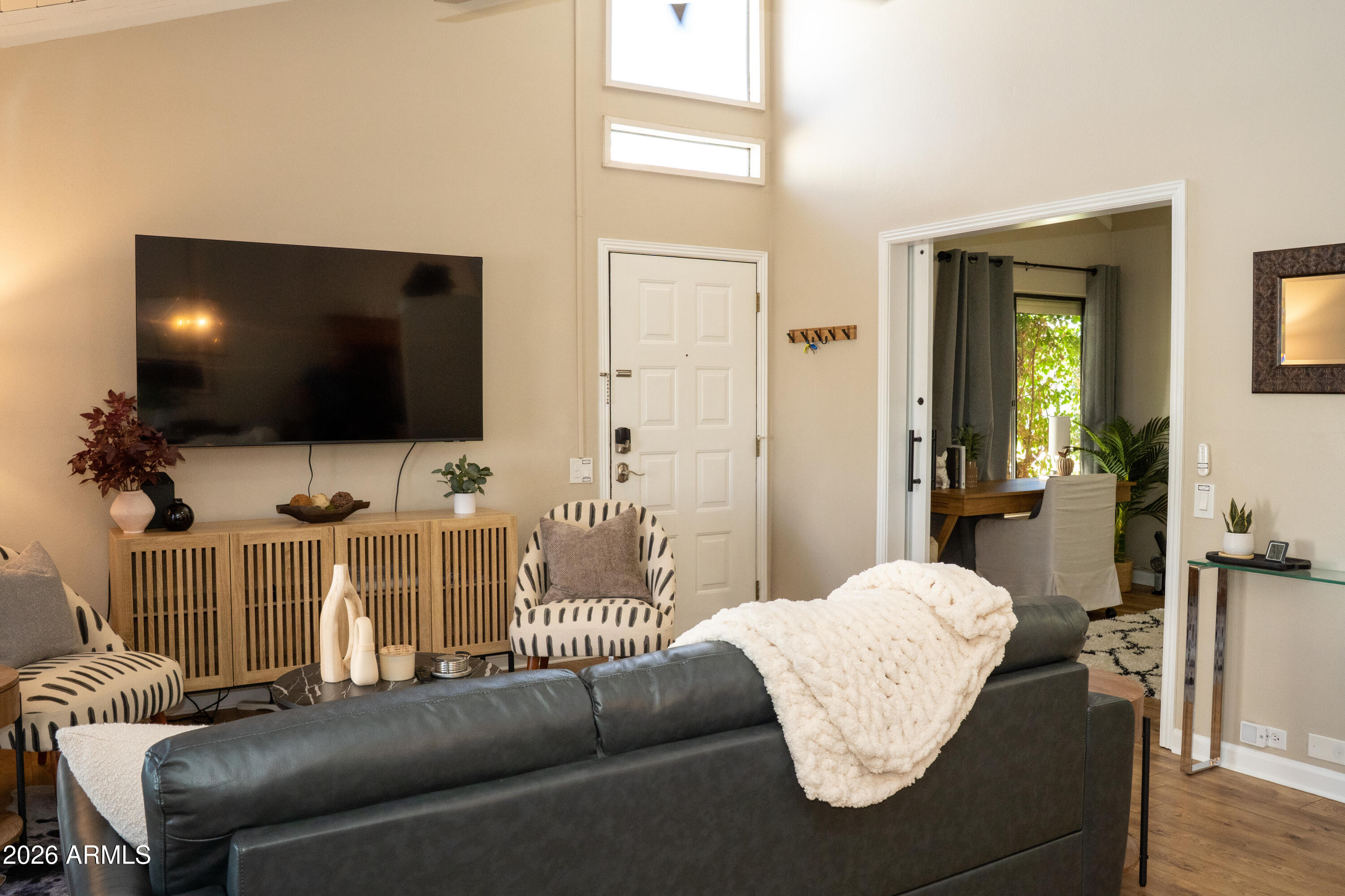 4313 North 28th Street Phoenix, AZ 85016 - Photo 2 of 26 a living room with furniture and a flat screen tv