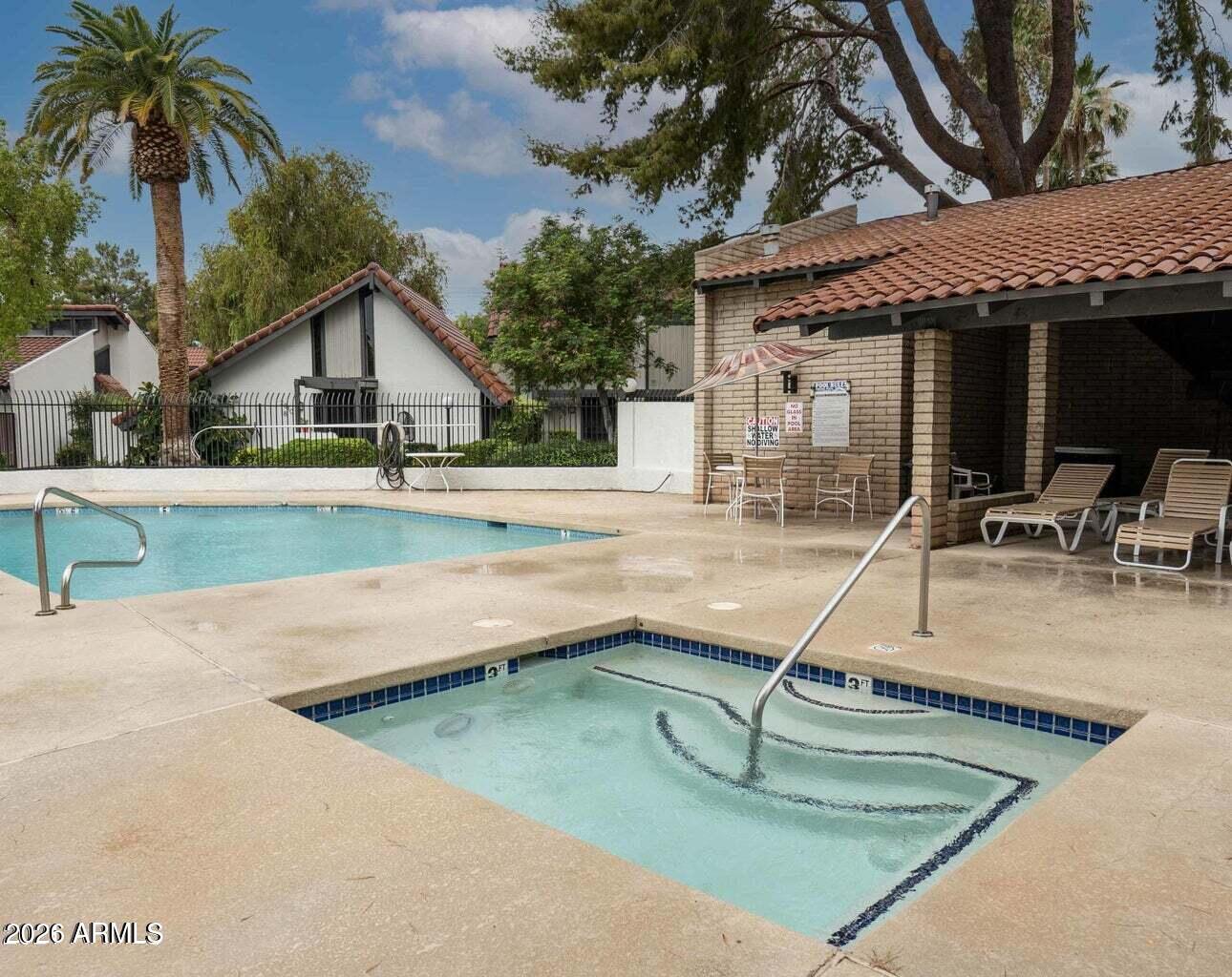4313 North 28th Street Phoenix, AZ 85016 - Photo 24 of 26 a view of a house with swimming pool and sitting area