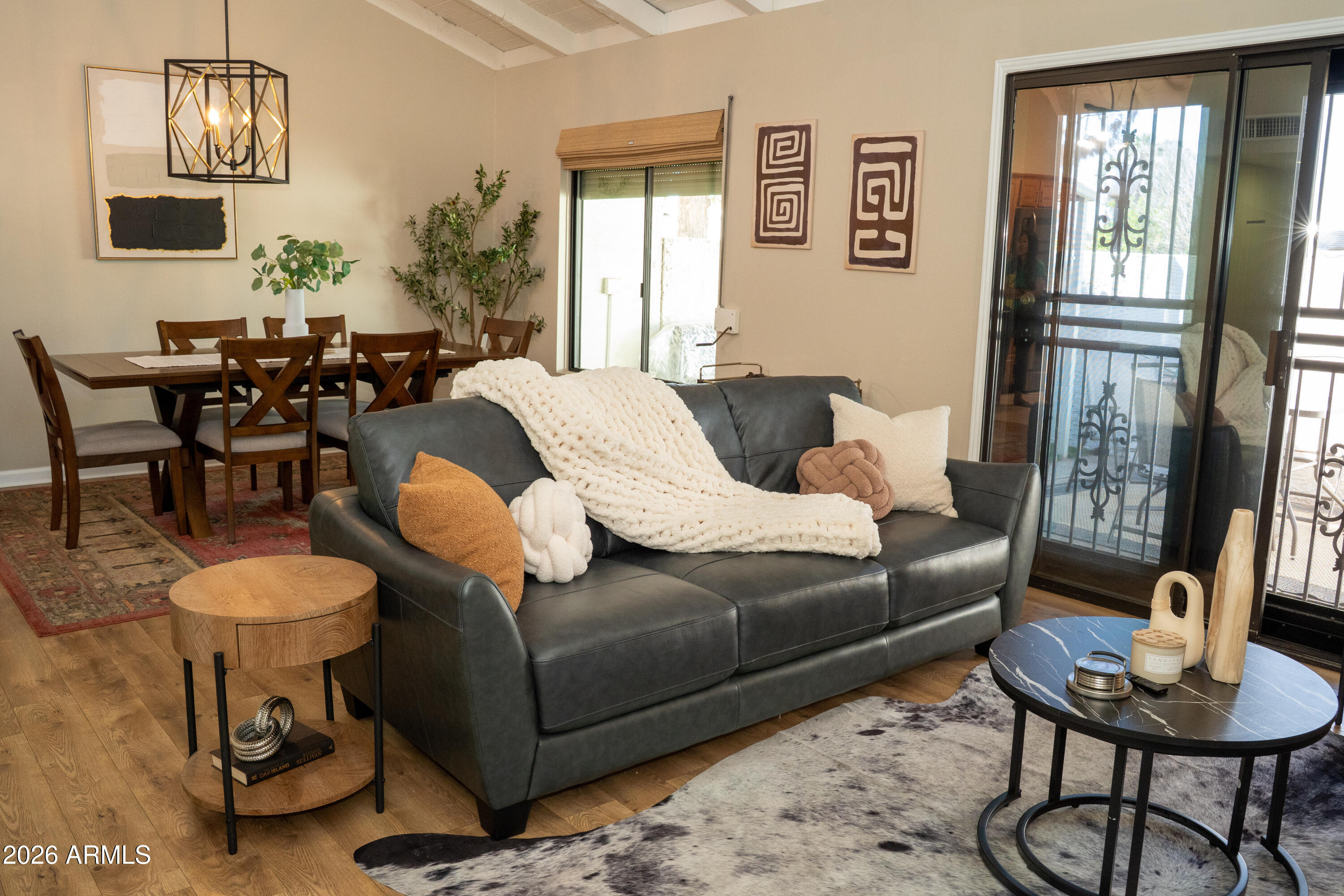 4313 North 28th Street Phoenix, AZ 85016 - Photo 4 of 26 a living room with furniture and a chandelier