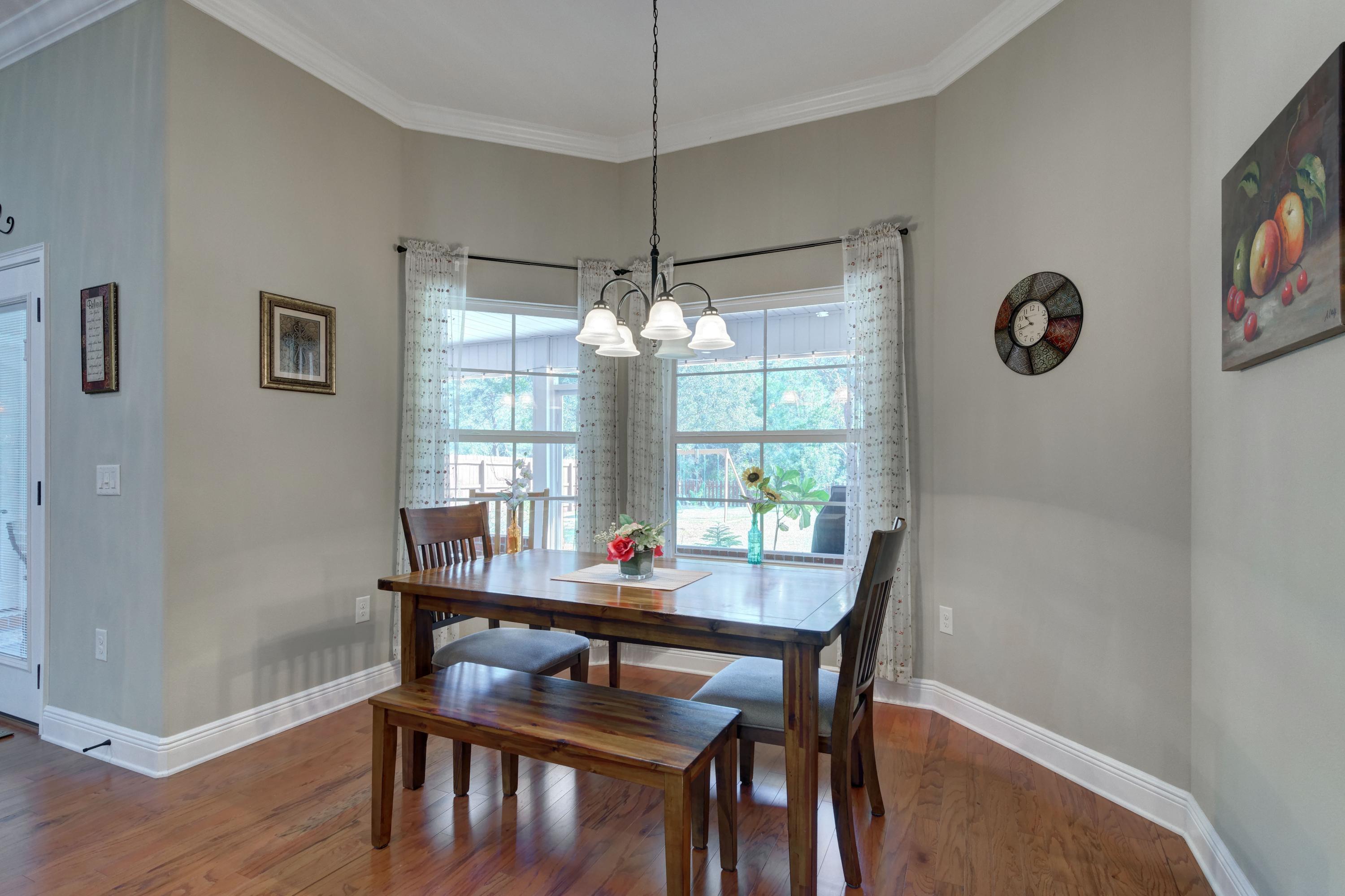 2592 Crescent Road Navarre, FL 32566 - Photo 16 of 67 a dining room with furniture and window