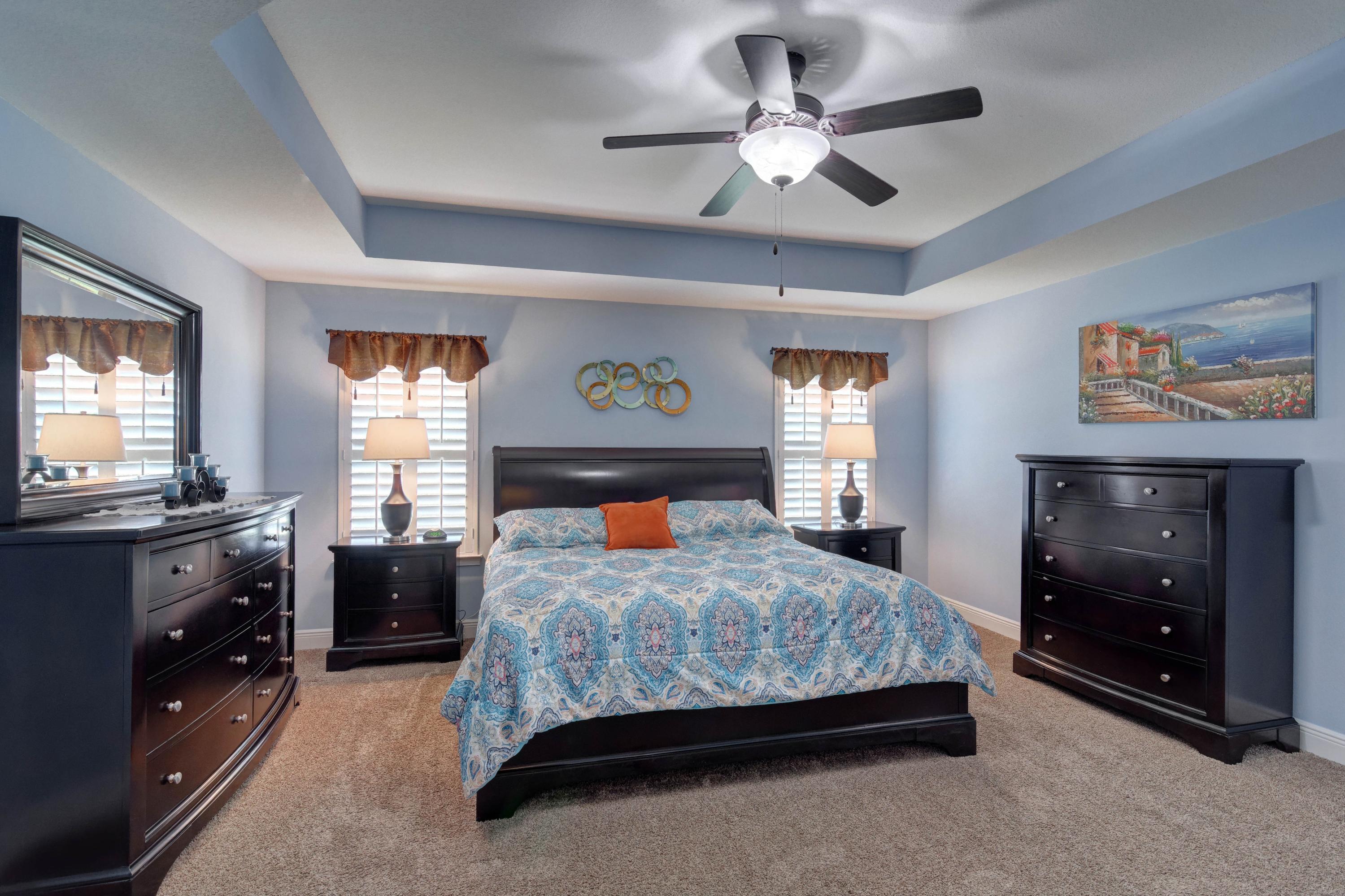 2592 Crescent Road Navarre, FL 32566 - Photo 25 of 67 a bedroom with a bed and a dresser in it
