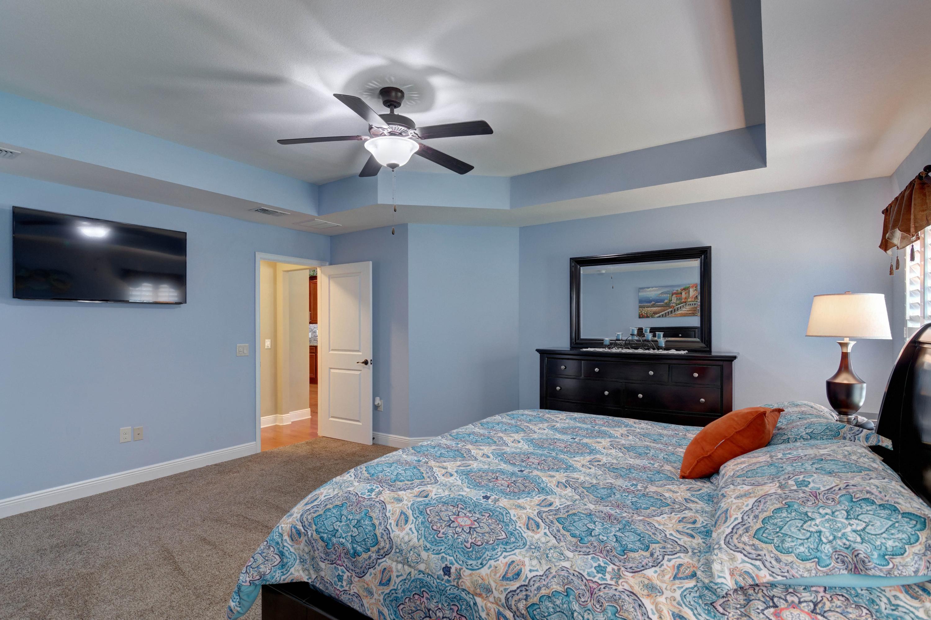 2592 Crescent Road Navarre, FL 32566 - Photo 27 of 67 a bedroom with a bed and a flat screen tv