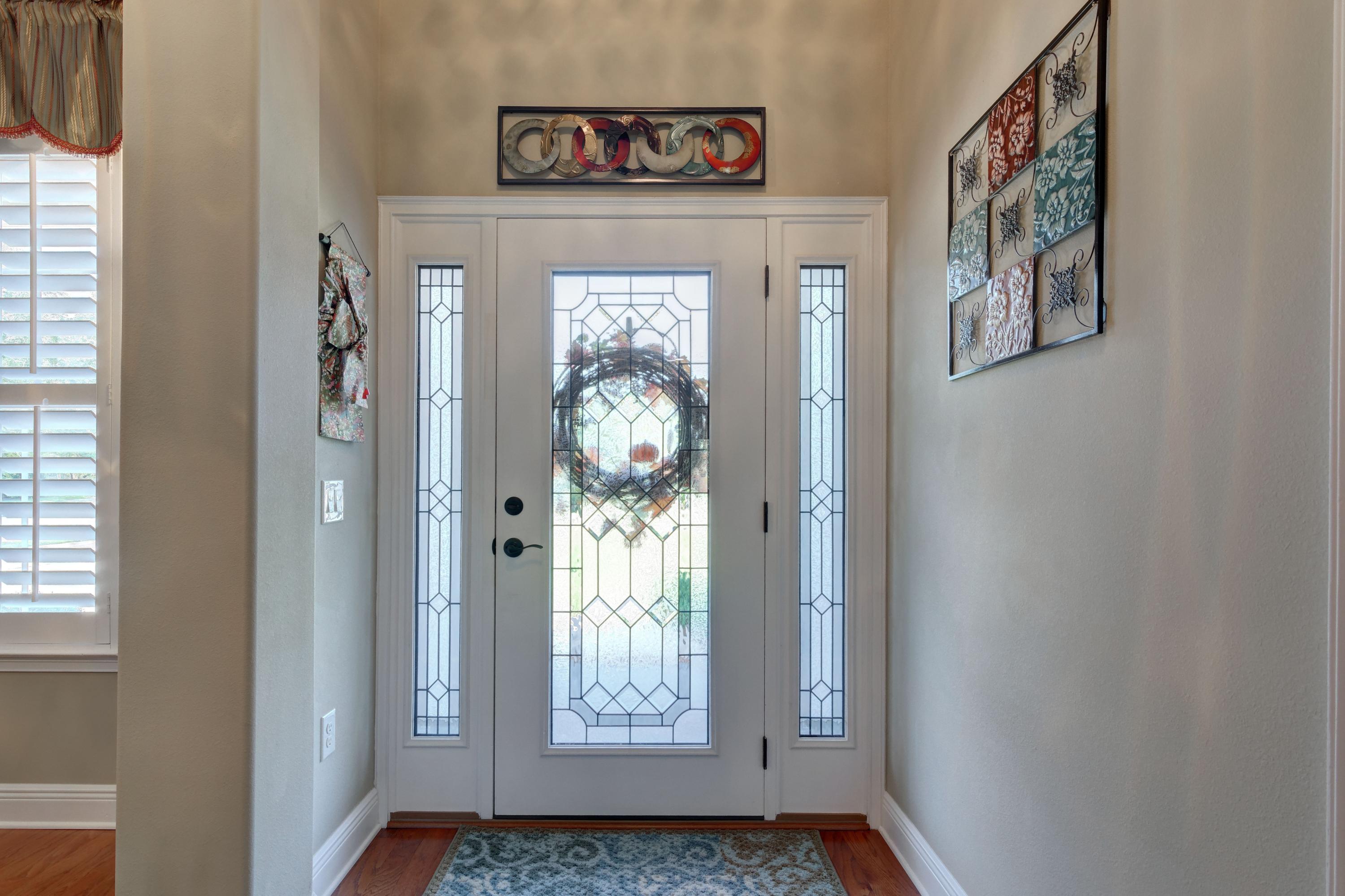 2592 Crescent Road Navarre, FL 32566 - Photo 3 of 67 a view of an entryway with wooden floor