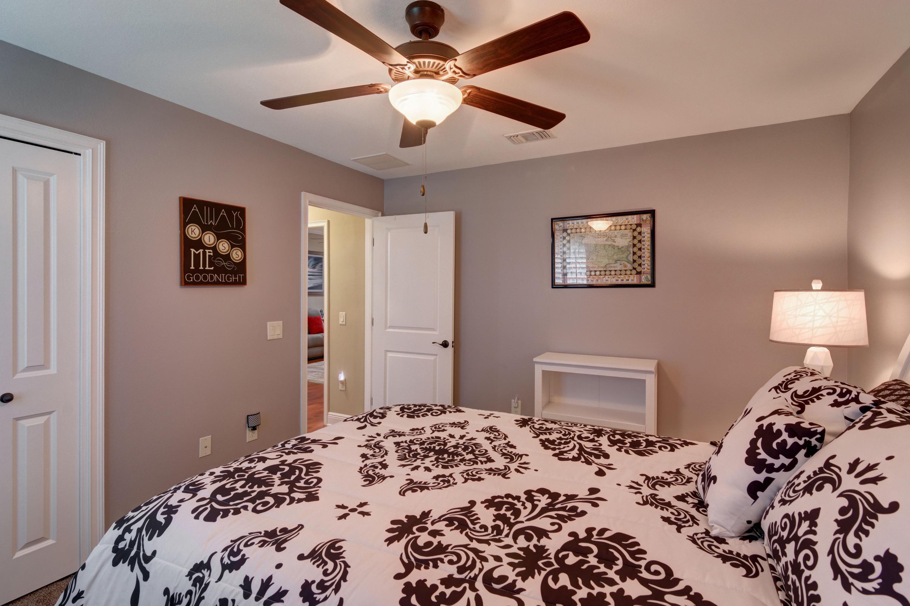 2592 Crescent Road Navarre, FL 32566 - Photo 37 of 67 a bedroom with bed and wooden floor