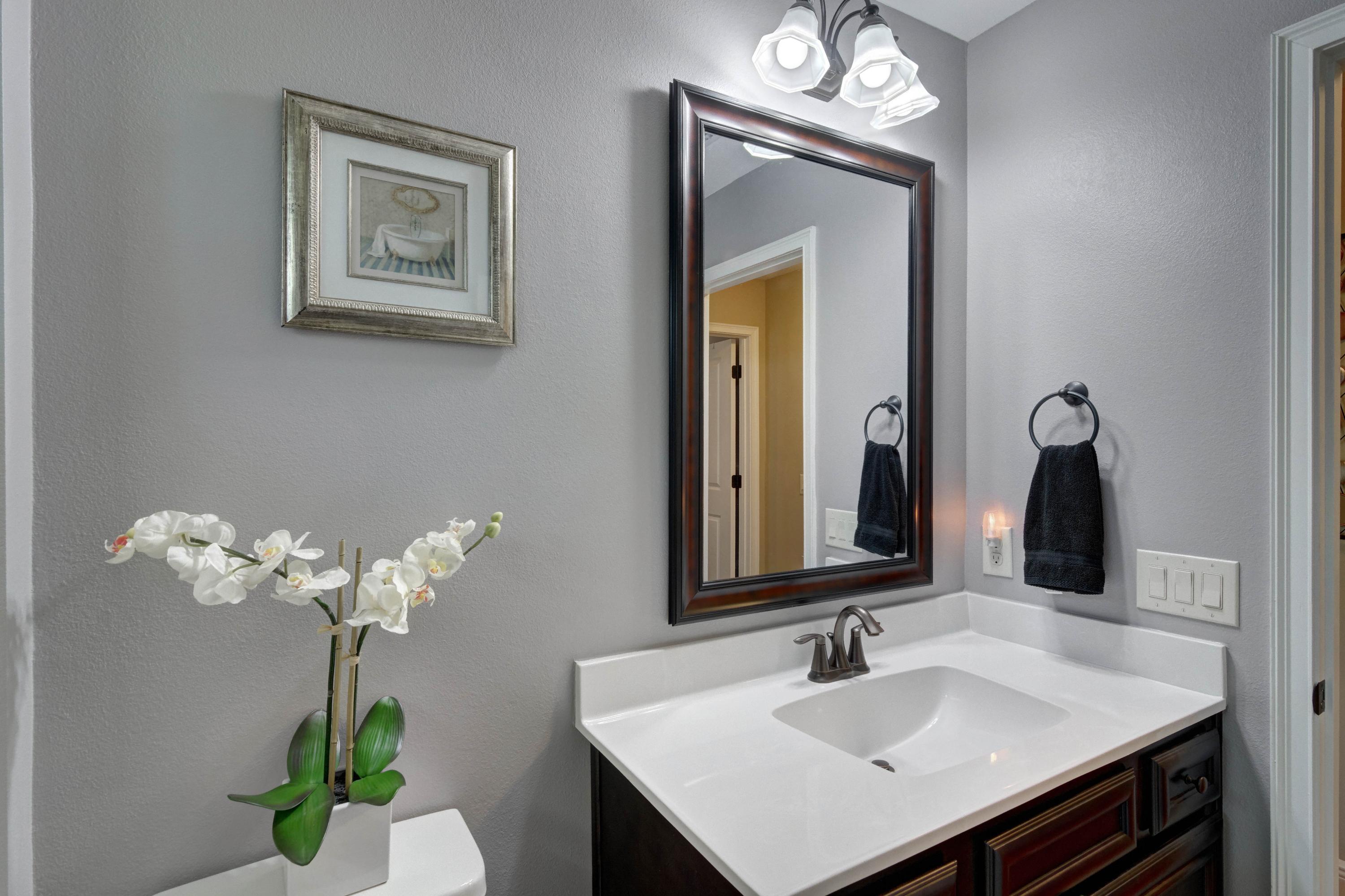 2592 Crescent Road Navarre, FL 32566 - Photo 39 of 67 a bathroom with a sink vanity and a mirror