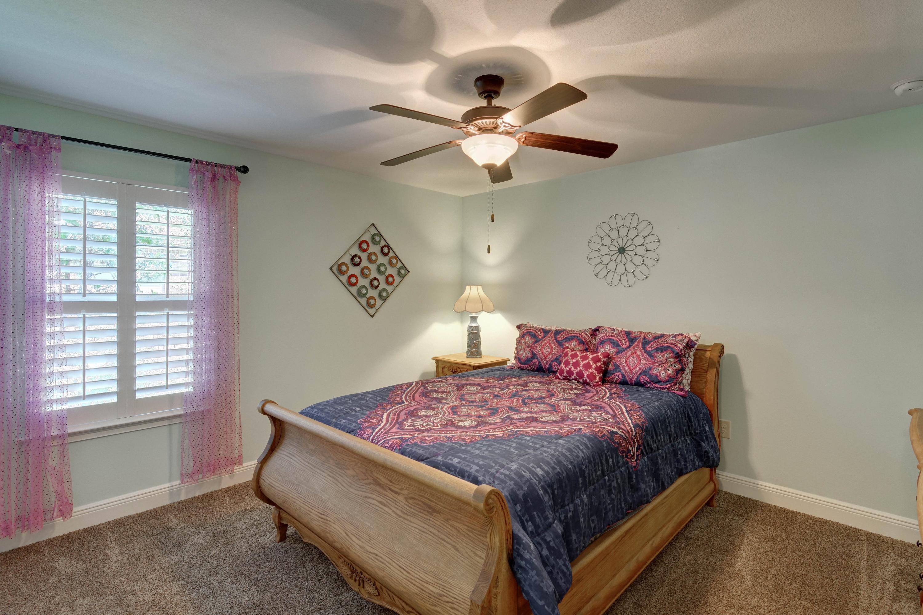 2592 Crescent Road Navarre, FL 32566 - Photo 40 of 67 a bedroom with a bed and a window