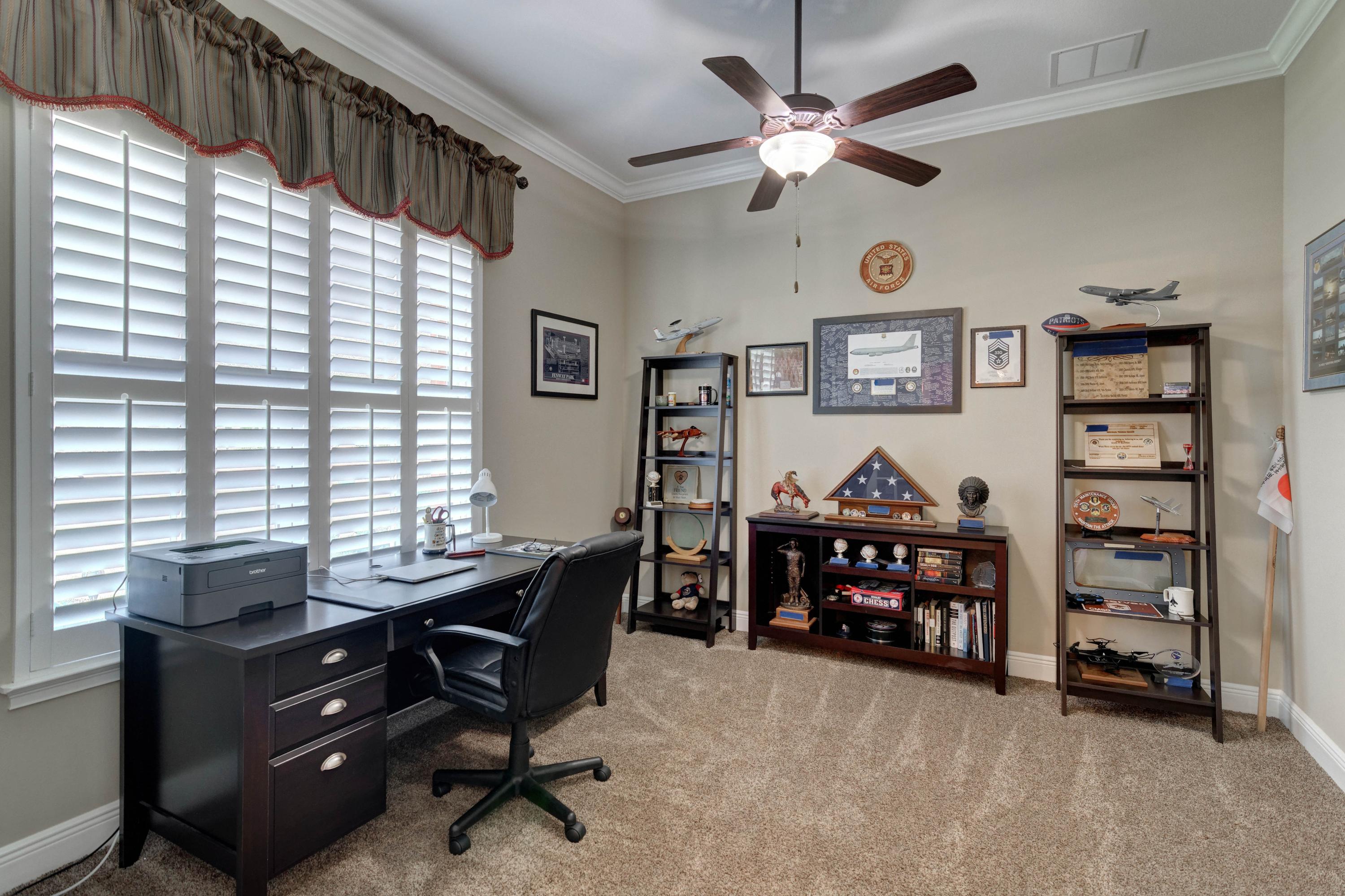 2592 Crescent Road Navarre, FL 32566 - Photo 5 of 67 a view of a workspace with furniture and a window