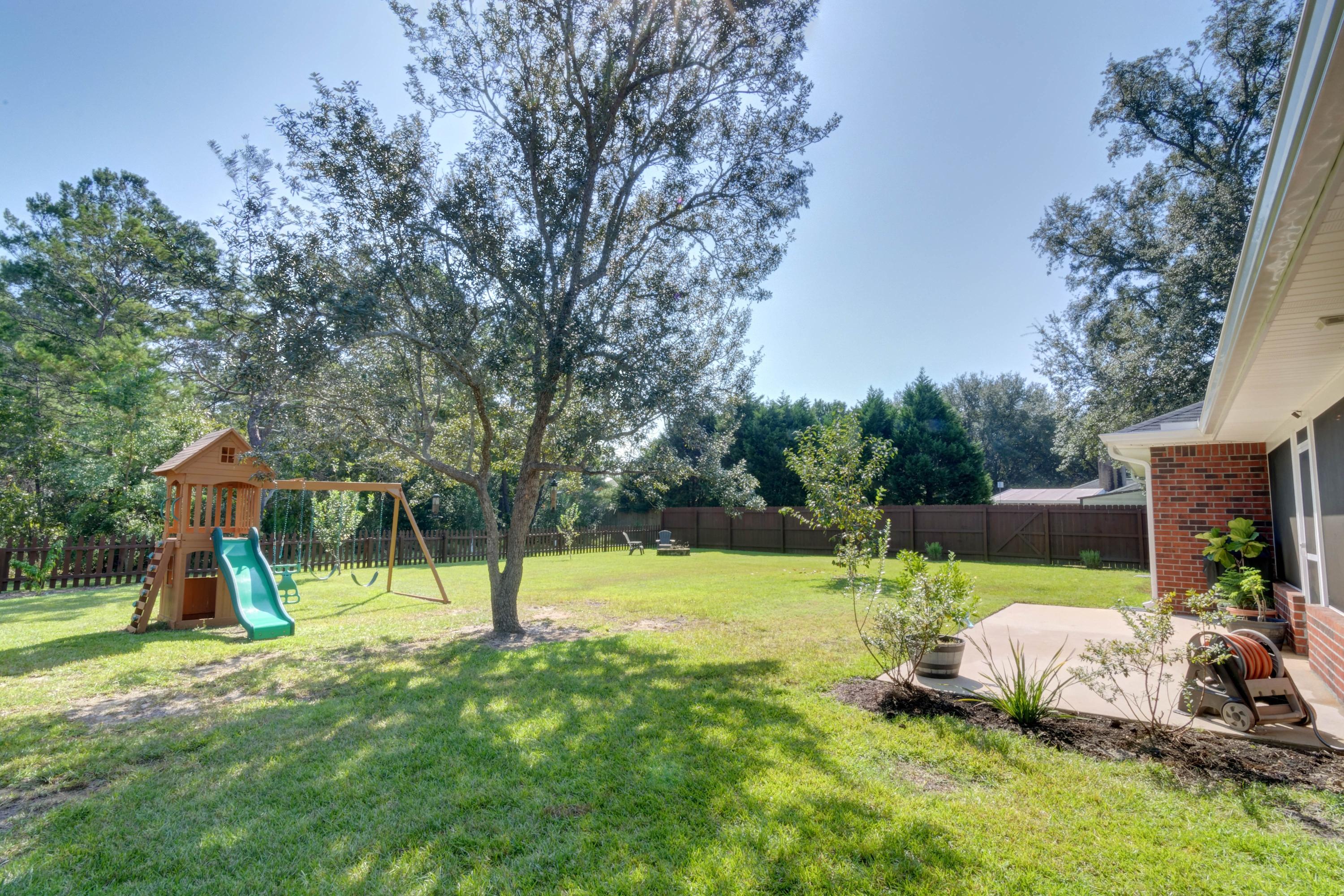 2592 Crescent Road Navarre, FL 32566 - Photo 53 of 67 a view of a park with swings and slides